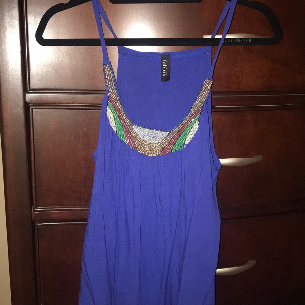Float beaded and blue tank! Great festival look!